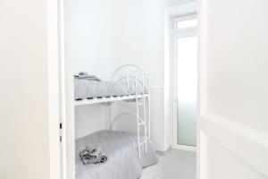 Ein Etagenbett oder Etagenbetten in einem Zimmer der Unterkunft Casa Trinacria