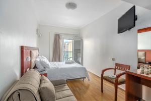 Postel nebo postele na pokoji v ubytování Attalos Hotel