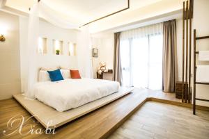Postel nebo postele na pokoji v ubytování Xia Bi Garden Wedding B&B