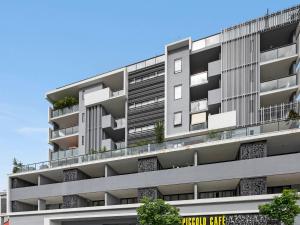 uma imagem de um edifício de apartamentos com varandas em Atrio Apartments em Brisbane