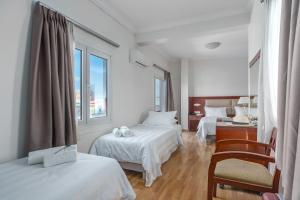Postel nebo postele na pokoji v ubytování Attalos Hotel