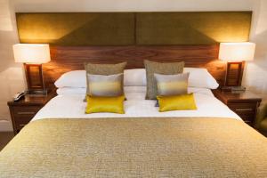 a hotel room with two beds and two lamps at Craigmonie Hotel Inverness by Compass Hospitality in Inverness