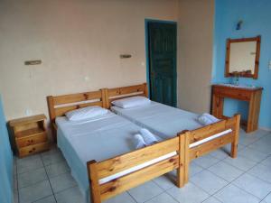 Ένα ή περισσότερα κρεβάτια σε δωμάτιο στο Lefkothea Apartments