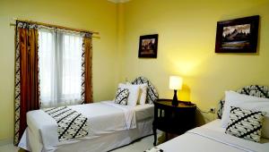 Voodi või voodid majutusasutuse Diana Hotel Jogja toas