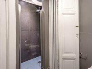 a bathroom with a shower with a toilet in it at B&B Stupido Hotel in Florence
