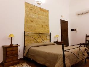 Posteľ alebo postele v izbe v ubytovaní B&B Cinisi Vacanze