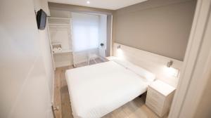 Posteľ alebo postele v izbe v ubytovaní Happy Hostal Carrales