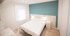 Posteľ alebo postele v izbe v ubytovaní Happy Hostal Carrales