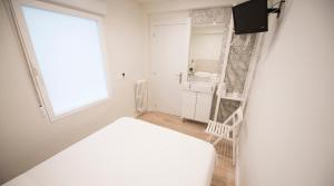 Posteľ alebo postele v izbe v ubytovaní Happy Hostal Carrales