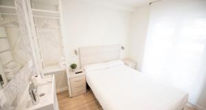 Posteľ alebo postele v izbe v ubytovaní Happy Hostal Carrales