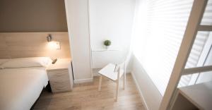 Posteľ alebo postele v izbe v ubytovaní Happy Hostal Carrales