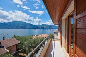 a balcony of a house with a view of a lake at Villa Anna in Brenzone sul Garda