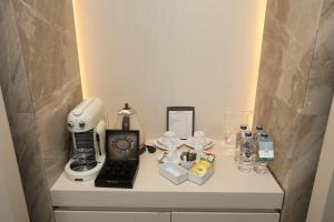 a table with a microscope and other items on it at Kemer Country Hotel İstanbul in Istanbul