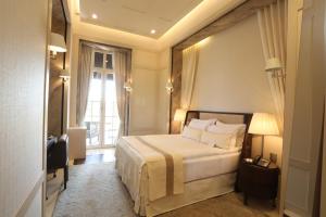 a hotel room with a bed and a window at Kemer Country Hotel İstanbul in Istanbul
