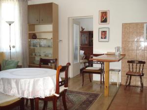 a living room with a table and a dining room at Apartament u Barbary in Wisełka