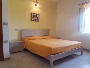 A bed or beds in a room at Villetta Marina