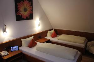 Katil atau katil-katil dalam bilik di Hotel Lamm
