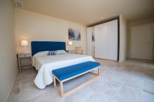 A bed or beds in a room at VILLA GALI