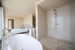 A bed or beds in a room at VILLA GALI