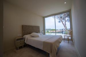 A bed or beds in a room at VILLA GALI
