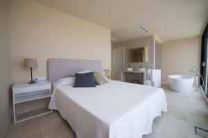A bed or beds in a room at VILLA GALI