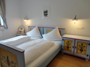 Posteľ alebo postele v izbe v ubytovaní Alpenferienwohnung Strickner