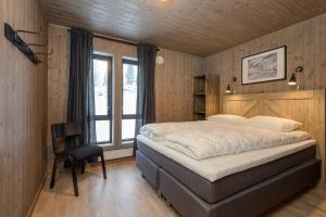 En eller flere senge i et værelse på Varden Fjellandsby Kvitfjell