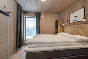 Кровать или кровати в номере Varden Fjellandsby Kvitfjell