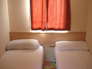 Posteľ alebo postele v izbe v ubytovaní Camping Valle Niza Playa