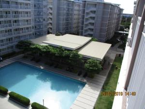 an overhead view of a building with a swimming pool at XNY at SMDC Trees Residences Quezon City-Studio in Manila