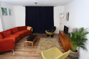 a living room with a couch and a tv at 3beds/2baths in Oxford Circus in London