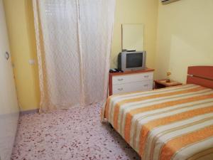 Tempat tidur dalam kamar di Villa Artemide