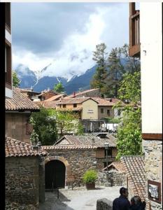 a group of people standing in a village with mountains at Casa Favila in Potes
