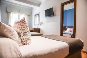 Postel nebo postele na pokoji v ubytování Hotel Costasol