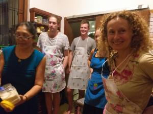 a group of people dressed in aprons posing for a picture at Cosy Nest Home stay in Negombo
