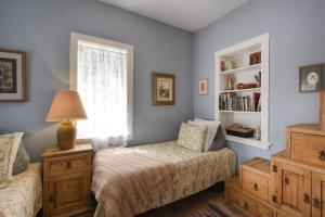 a bedroom with a bed and a window at Barrio Casita 1 in Tucson