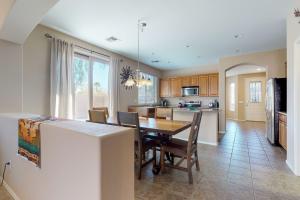 a kitchen and dining room with a table and chairs at Mesquite Vista in Peoria