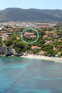 an aerial view of a beach with a green circle at Hotel Acquamarina in Portoferraio