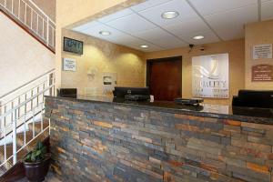 a lobby of a dental office with a stone counter at Quality Inn Richburg in Richburg