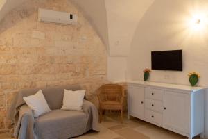 TV a/nebo společenská místnost v ubytování Masseria Pugliese Farm