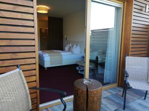 Postel nebo postele na pokoji v ubytování Golf Resort Klöch
