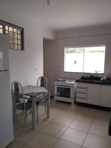 Kuchyň nebo kuchyňský kout v ubytování Apartamento Cidade Verde 4 MT