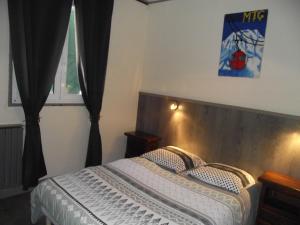 Postel nebo postele na pokoji v ubytování Hotel Valérie