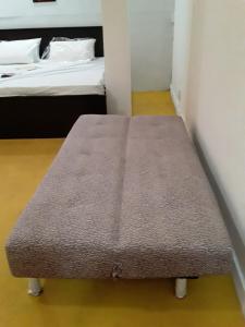 Un pat sau paturi într-o cameră la Lisari villa
