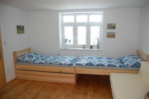 Кровать или кровати в номере Dům na pohodu