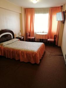 מיטה או מיטות בחדר ב-Hotel La Joya