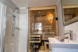a bathroom with a shower and a sink at Ferienhaus am Fluss. Baubiologisch renoviert. in Bad Kreuznach +54 photos