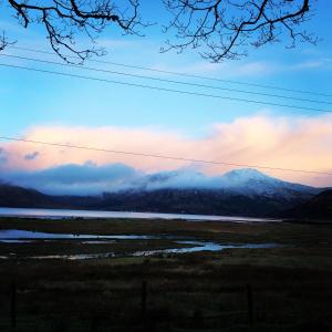 a view of a mountain range with snow capped mountains at Skye View in Glenelg