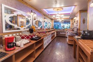 a restaurant with a long counter with many dishes at Senabil Hotel Old City & Spa in Istanbul