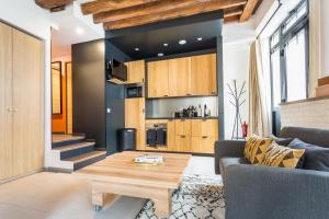 a living room with a couch and a table at CMG Voltaire// Père Lachaise in Paris